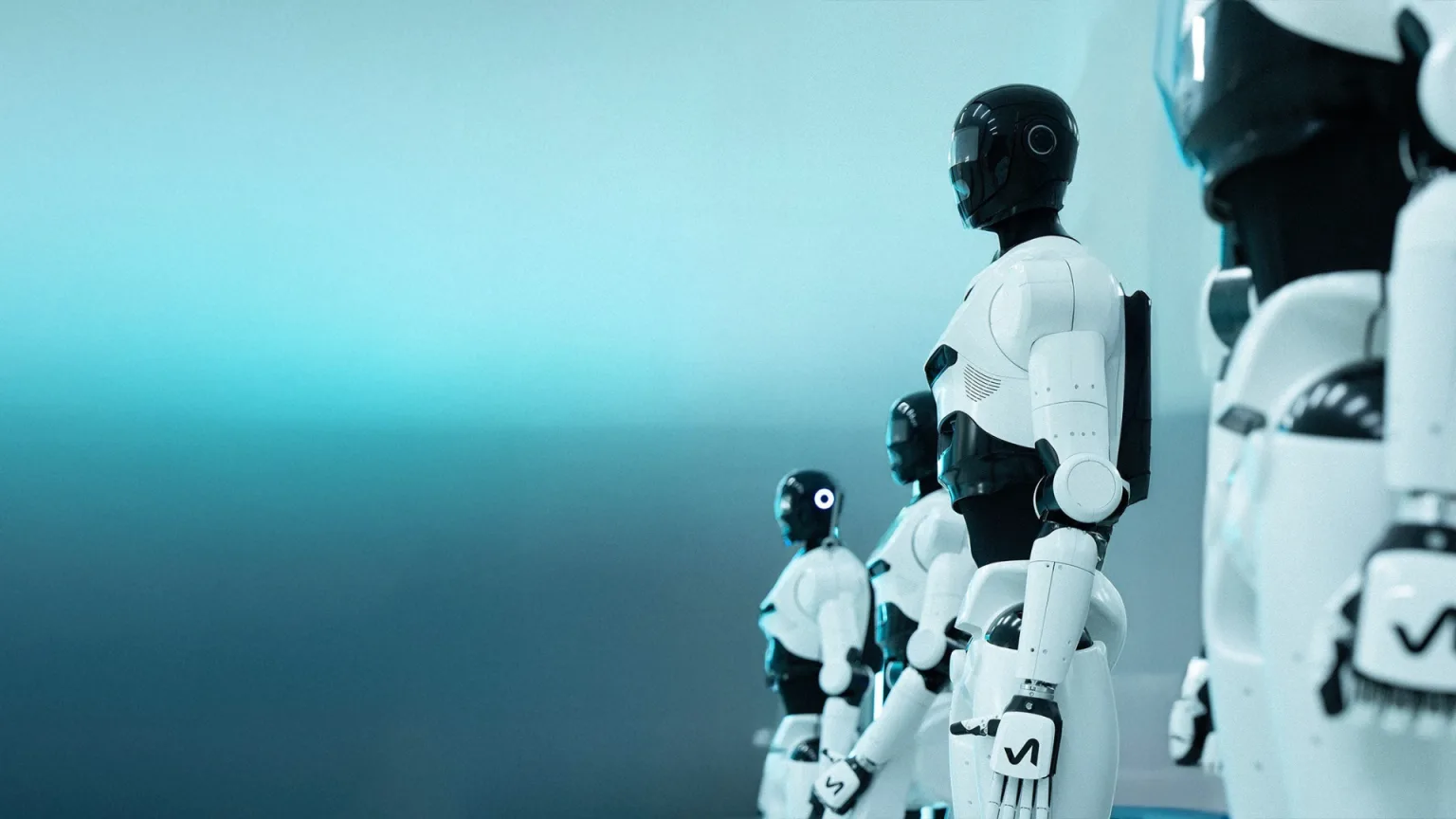 A row of white-and-black 4NE-1 humanoid robots standing in formation against a blue backdrop.