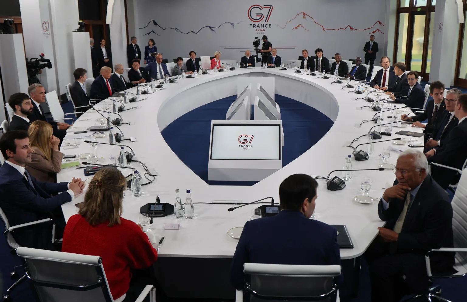 Robin Rombach seated at a G7 AI roundtable with national and European leaders.