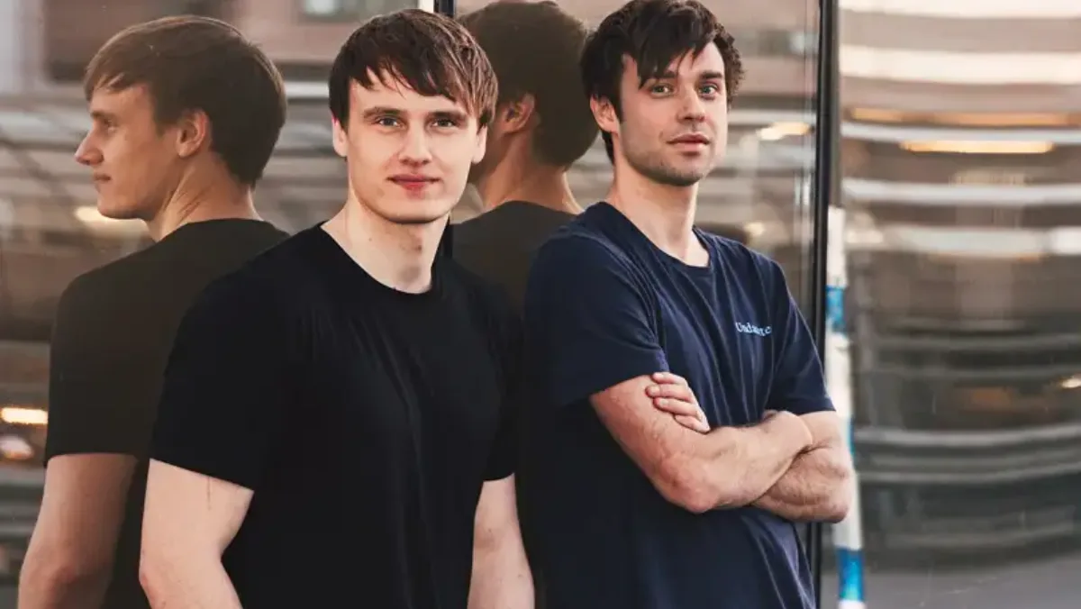 Lovable co-founders Anton Osika and Fabian Hedin standing in front of a glass facade.