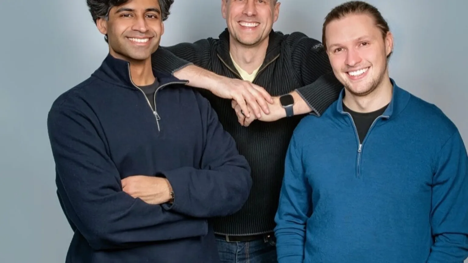 The three Prior Labs co-founders standing together against a grey backdrop.